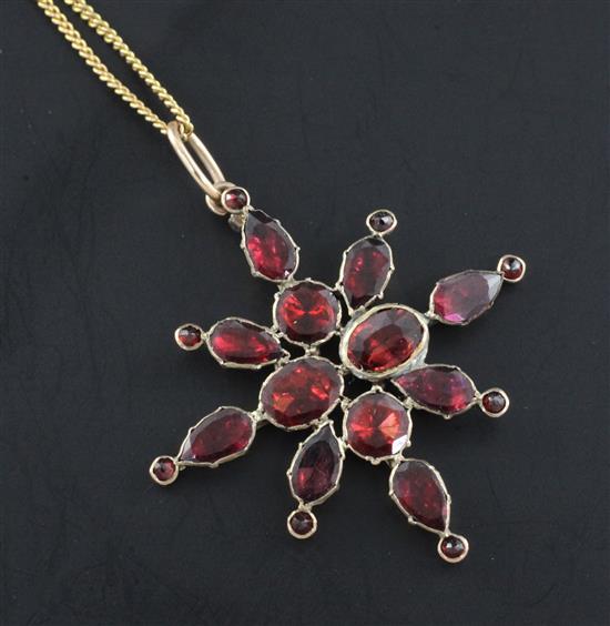 A Victorian gold and garnet set star pendant, pendant 1.5in.